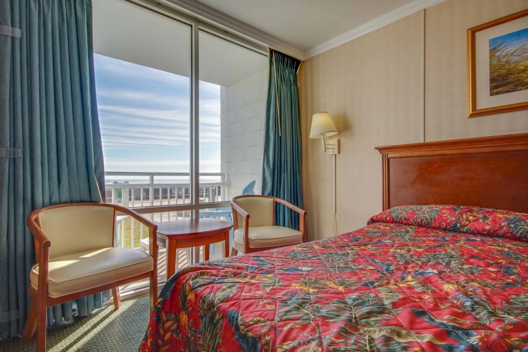 Sahara Motel bedroom with balcony overlooking the boardwalk and ocean in OCMD