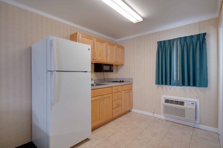 Sahara Motel kitchen with tile floors and window